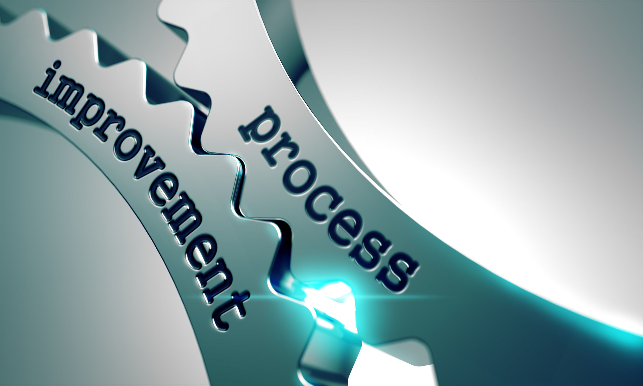 Image of two cogs working together, marked “process enhancement”
