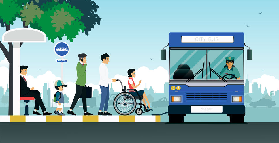 Picture of a wheelchair user getting on a bus.