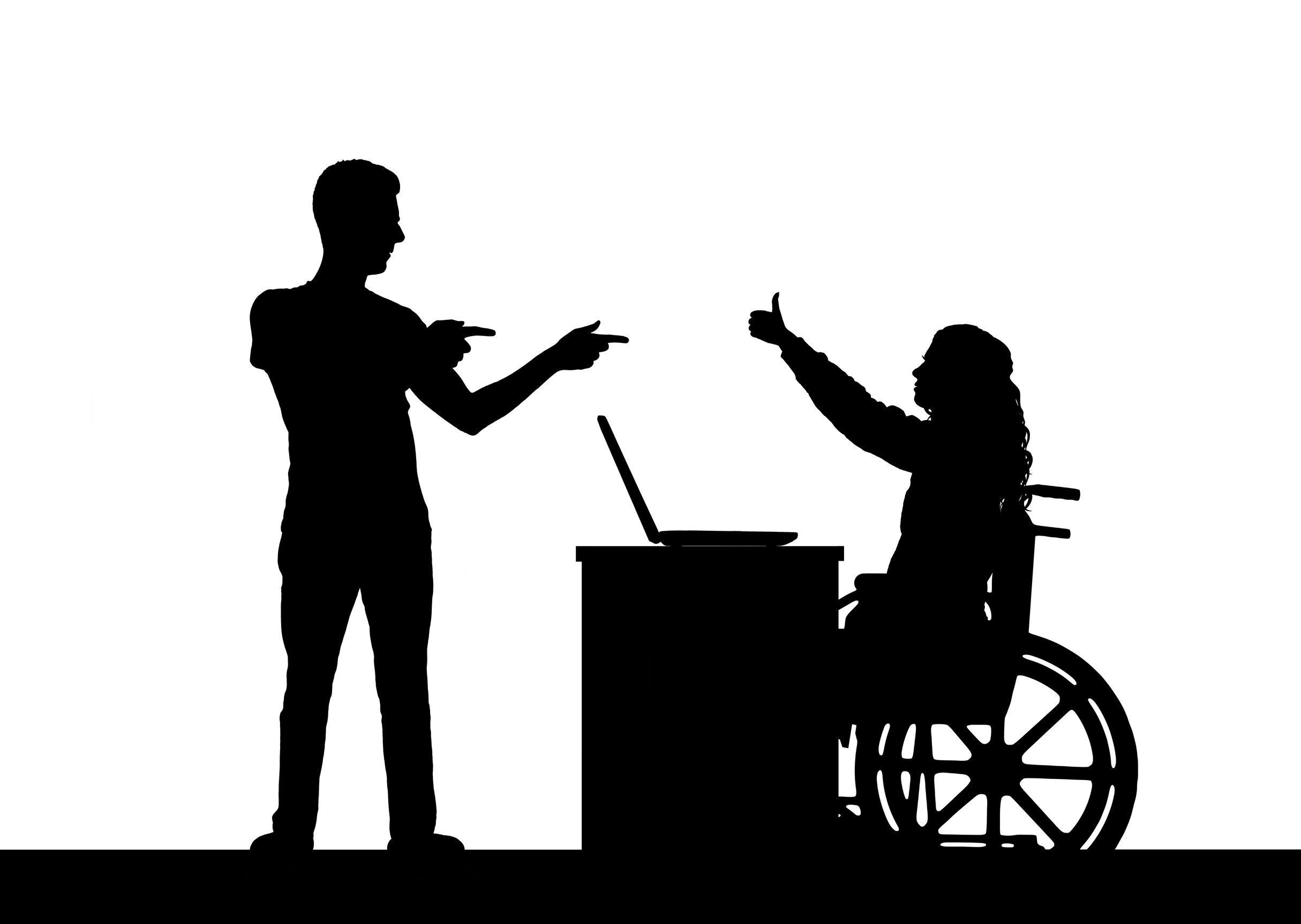 剪影：一位男子向一位殘疾同事竪起大拇指
